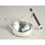 A CIRCULAR CHRISTOPHER DRESSER DESIGN SILVER PLATED TEA POT. 5.5ins high.