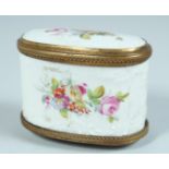 A 19TH CENTURY PORCELAIN DOUBLE ENAMEL BOX painted with flowers with gilt mounts. 3ins long.