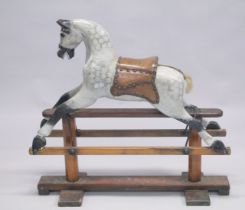 A VICTORIAN PAINTED WOOD ROCKING HORSE. 2ft 8ins high.
