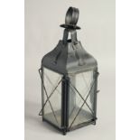 AN OLD BLACK PAINTED TIN LANTERN. 13ins high.