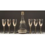 A SUPERB SILVER AND GLASS DECANTER, WINE COOLER AND SIX CHAMPAGNE GLASSES, made by GOLDSMITHS AND