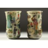 A RARE PAIR OF "DECALCOMANIA" 19TH CENTURY GLASS BEAKERS with Chinese designs. 6ins high x 3.5ins
