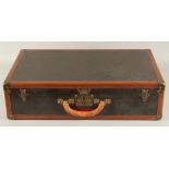 A LOUIS VUITTON SUITCASE. No. 816144, with Louis Vuitton label. Pull-out tray. Lock No. 107170.