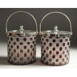 A PAIR OF CUT GLASS, RUBY TINTED AND PLATE BISCUIT BARRELS.
