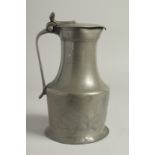 A LARGE 18TH CENTURY NORMANDY JUG AND COVER. 10ins high.