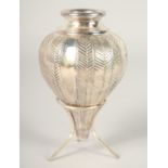 A SILVER LALAOUNIS VASE AND STAND. 6ins high in a Lalanouis box.