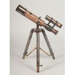 A LEATHER TELESCOPE ON A STAND. 1ft high.
