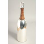 A SILVER PLATED CHAMPAGNE BOTTLE COCKTAIL SHAKER. 14ins high