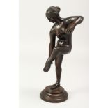 A 19TH CENTURY BRONZE STANDING NUDE on a circular base. 10ins high.