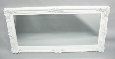 A LARGE WHITE PAINTED MIRROR. 5ft 6ins x 2ft 8ins.