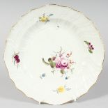 A GOOD MEISSEN CIRCULAR PLATE sprigged and painted with flowers. Cross swords mark in blue. 9ins