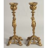 A GOOD PAIR OF ORMOLU CANDLESTICKS, ROCOCCO with classical female figure. 12ins high.