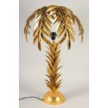 A GILT METAL PALM TREE TABLE LAMP. 2ft 4ins high.