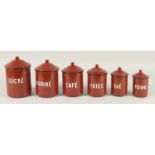 A SET OF ENAMEL STORAGE JARS.