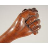 A FOLK ART WALKING STICK, 'Clenched Fist'. 36ins long.