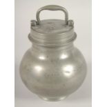 AN 18TH CENTURY FRENCH PEWTER BULBOUS CAN AND COVER with carrying handles. 7ins high, bears Paris