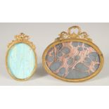 TWO FRENCH OVAL GILT PHOTOGRAPH FRAMES. 3ins x 2ins & 3ins x 4.5ins.