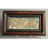 AN EARLY MAJOLICA PLAQUE, POSSIBLY 15-16TH CENTURY. A battle scene 7ins x 18ins frame.