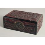 A CHINESE LACQUERED WOOD RECTANGULAR BOX with carved decoration and hinged lid. 21cm x 14cm