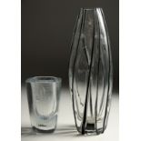 A SMALL PLAIN SWEDISH GLASS VASE. Signed. 4.75ins high, and a TALL VASE with applied stripes,