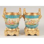 A GOOD PAIR OF SEVRES STYLE PORCELAIN AND GILT METAL CACHE POTS. 1ft 1ins high.