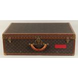 A LARGE LOUIS VUITTON SUITCASE. No. 081502. With Louis Vuitton label. Lock no. 1078192 with key.