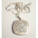 A SILVER LOCKET AND CHAIN.