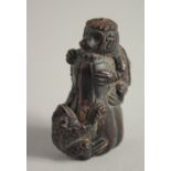 A WOODEN NETSUKE OF A FROG. 2ins