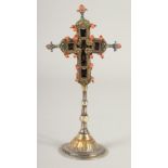 A SMALL 17TH -18TH CENTURY SILVER GILT CROSS enclosing a coral crucifix, with inscriptions and dated