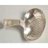 A GEORGE III SILVER ENGRAVED CADDY SPOON. Birmingham 1809.