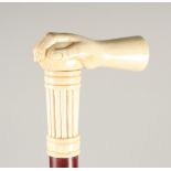 A CARVED BONE HANDLE WALKING STICK, 'HAND'. 3ft long