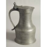 A SMALL TAPPET HEN PEWTER FLAGON AND COVER 7ins high.