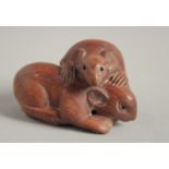 A WOODEN NETSUKE OF TWO RATS. 2ins long.
