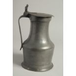 AN 18TH CENTURY FRENCH PEWTER JUG AND COVER. 10ins high.