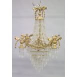 A GOOD GILT BRONZE AND CRYSTAL CHANDELIER with prism drops and cupids. 3ft long.
