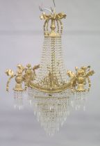 A GOOD GILT BRONZE AND CRYSTAL CHANDELIER with prism drops and cupids. 3ft long.