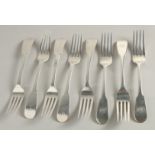 A COMPOSITE SET OF EIGHT GEORGE III SILVER SCOTTISH FIDDLE PATTERN TABLE FORKS. Edinburgh 1815 and