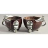 A PAIR OF SILVER MOUNTED COCONUT CUPS 4ins