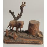 A BLACK FOREST CARVED WOOD "DOG" INKSTAND. 6ins long.