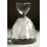 A LARGE CUT CRYSTAL CIRCULAR SCENT BOTTLE AND STOPPER. 8.5ins high.