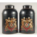 A PAIR OF BLACK TOLEWARE TEA JARS AND COVERS. 11ins high.
