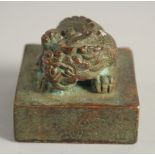 A CHINESE ARCHAIC STYLE BRONZE SEAL, the top with dragon. 5.5cm square