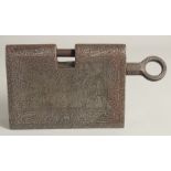 A LARGE ISLAMIC ENGRAVED STEEL LOCK, with bands of calligraphy and spring-operated locking system,