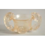 A CHINESE KUI DRAGON GLASS TWIN-HANDLE LIBATION CUP. 10cm handle to handle
