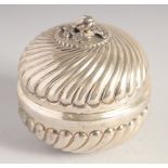 A SILVER CIRCULAR BOX AND COVER, the cover with naturalistic knop, ribbed decoration to the cover