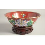 A GOOD CHINESE RED GROUND CLOISONNE BOWL, finely decorated with native flora, together with fitted