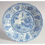 A CHINESE BLUE AND WHITE KRAAK PORCELAIN BOWL, painted with a central panel of birds by water and