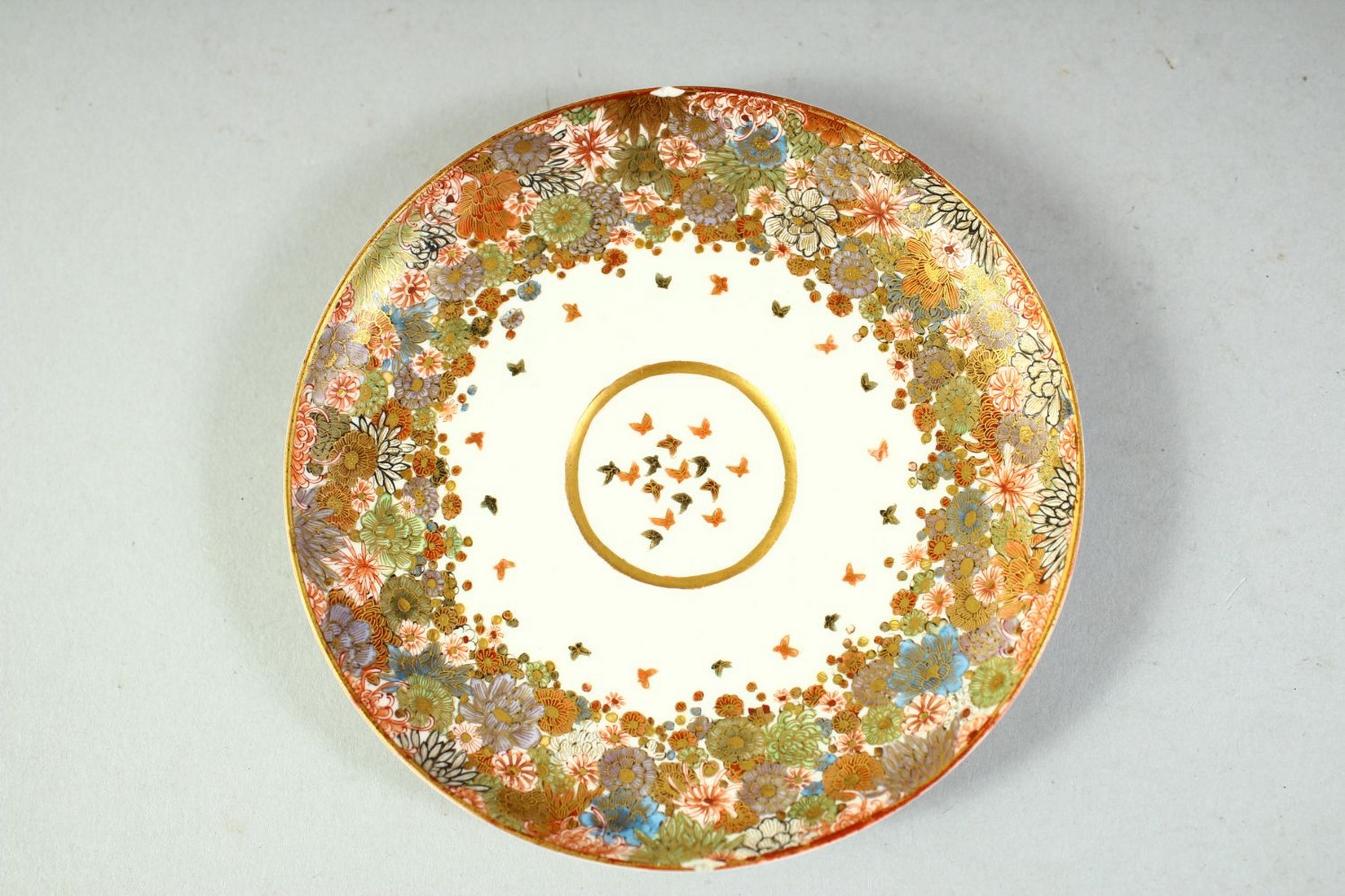 A SMALL JAPANESE SATSUMA CUP AND SAUCER, finely decorated with flowers and butterflies, each piece - Image 5 of 6