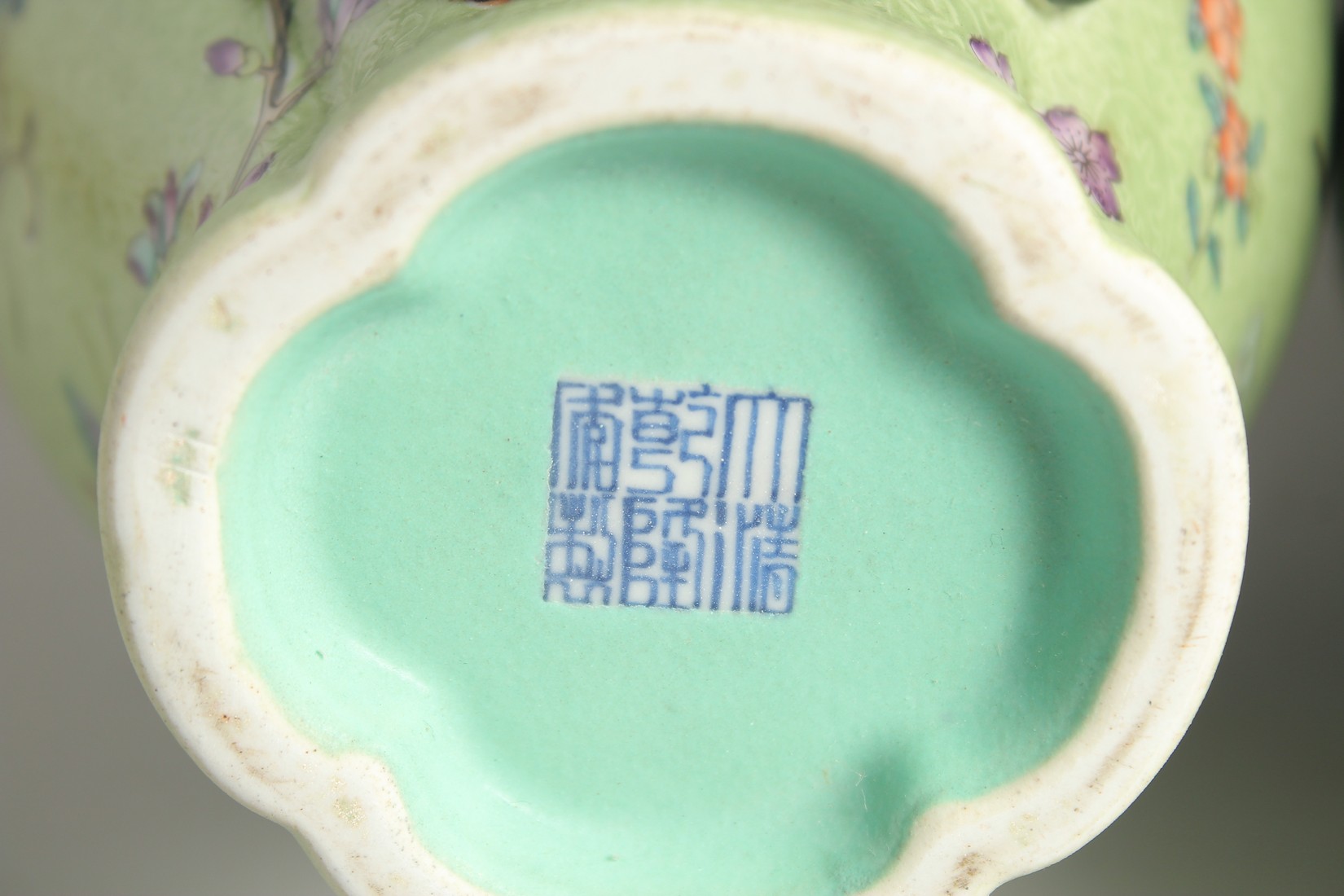 A PAIR OF CHINESE GREEN GROUND PORCELAIN VASES, with relief peach blossom and further decorated with - Image 7 of 8