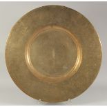 A VERY FINELY ENGRAVED 19TH CENTURY INDIAN BRASS TRAY, the centre with a ring of fish, and further